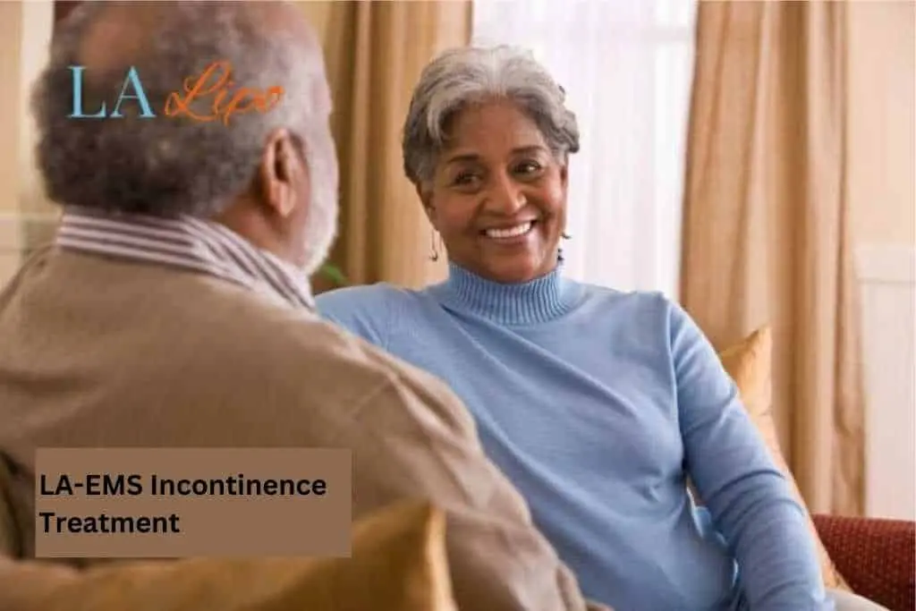 Couple sat smiling at each other - LA-EMS treatment Corby